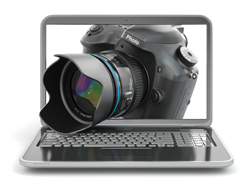 Digital photo camera and laptop. Journalist  or  traveler equipment. 3d